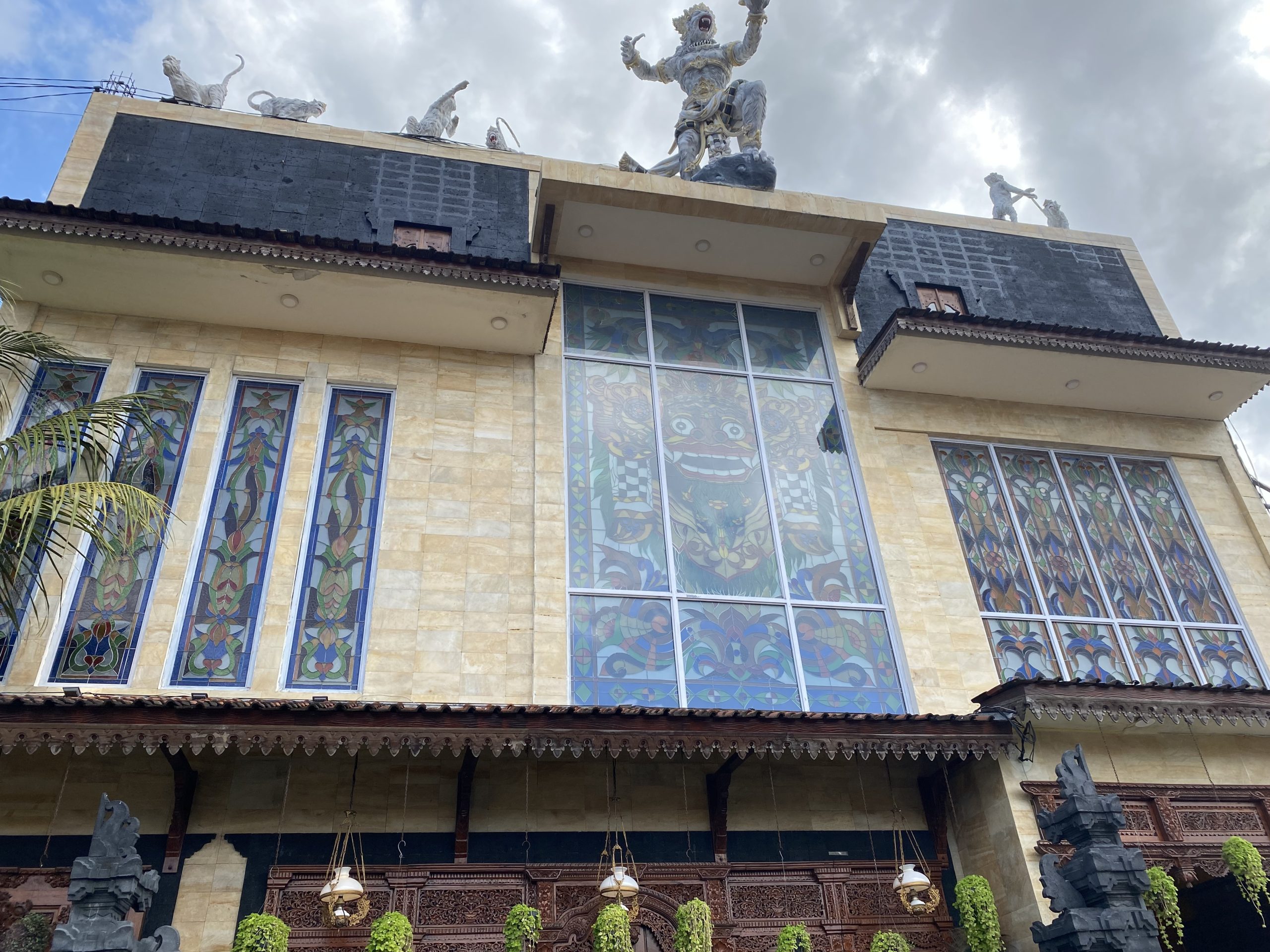 Exterior view of Lex Santoso's antique museum with stained glass windows in Ubud