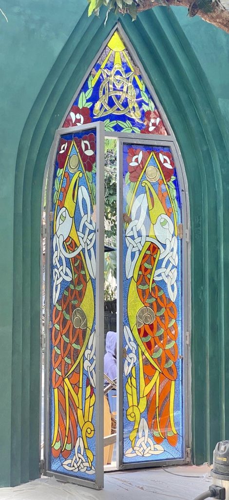 huge stained glass door in merlin restaurant, ubud, bali