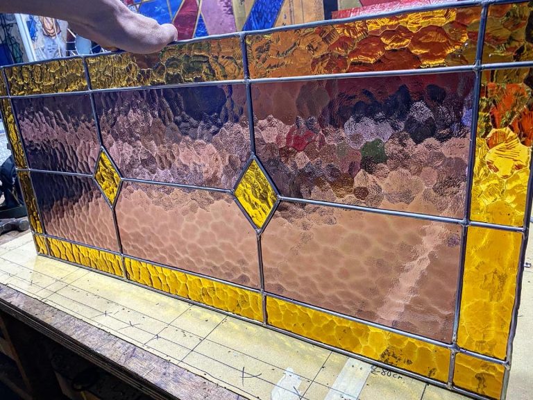 stained glass yellow amber and peachy purple colour detailed close up look