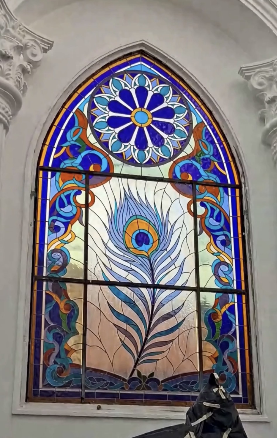 Peacock feather stained glass window, 2 by 4 metres, installed in the outdoor lounge of a private home in Kerobokan, Bali
