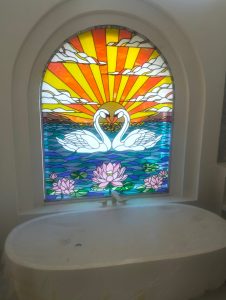 Two white swan stained glass
